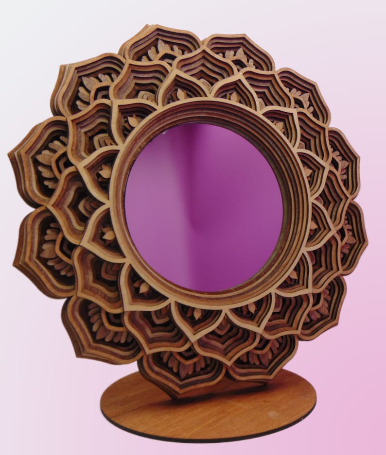 Adorn your space with this stunning wooden mandala mirror, exuding bohemian charm and intricate beauty. This handmade decorative mirror features a mesmerizing mandala design, perfect for adding a touch of whimsy and spiritual energy to your space.