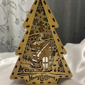 Embrace the festive spirit with our charming Standing Christmas Tree, a delightful addition to your holiday decor. This beautifully crafted Christmas tree decor not only adds a festive touch but also serves as a delightful Christmas Tea Light Holder.