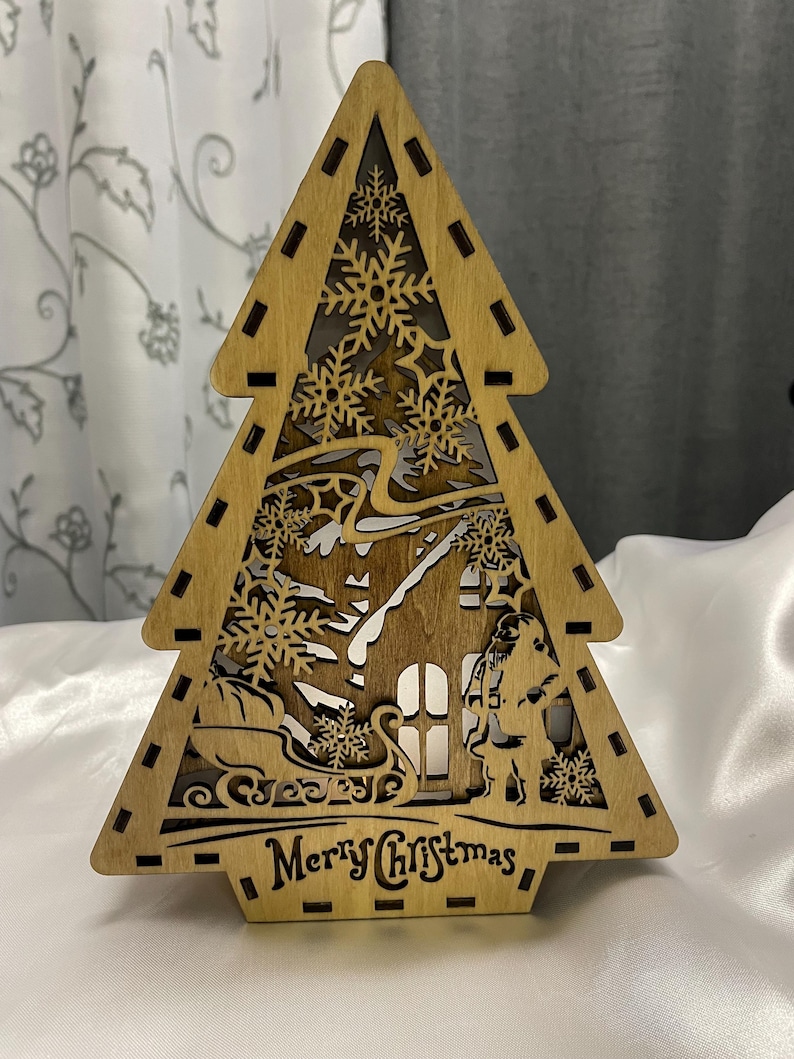 Embrace the festive spirit with our charming Standing Christmas Tree, a delightful addition to your holiday decor. This beautifully crafted Christmas tree decor not only adds a festive touch but also serves as a delightful Christmas Tea Light Holder.