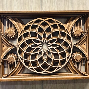 Add a touch of spiritual harmony to your living space with this stunning sacred geometry Mandala. This framed mandala features the mesmerizing Flower of Life design at its center, surrounded by radiating geometric patterns inspired by the Torus.