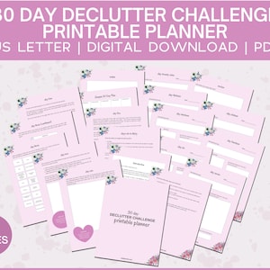 May include: A printable planner with a pink background and floral accents. The planner is titled "30 Day Declutter Challenge Printable Planner" and includes 40 pages.