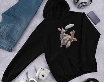 May include: Black hoodie featuring a cartoon illustration of a rabbit riding a tortoise, with the text "SLOW DOWN!" in a speech bubble. The hoodie is made of a soft material and has a hood and a front pocket.