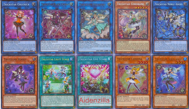 Puede incluir: Una colecci&oacute;n de diez cartas coleccionables coloridas de la serie "Trickstar". Cada carta tiene un dise&ntilde;o &uacute;nico con personajes de fantas&iacute;a y texto. Las cartas son de varios colores, incluyendo azul, naranja y verde.