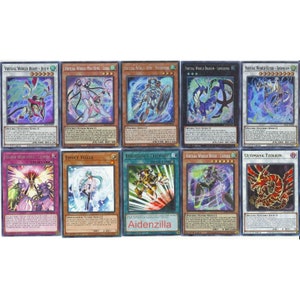 May include: A collection of ten Yu-Gi-Oh! trading cards featuring various characters and monsters. The cards are in a holographic finish and have a variety of colors, including blue, red, green, and purple.