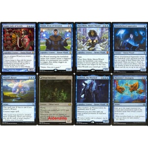 May include: A set of ten blue and white Magic: The Gathering cards featuring wizards and other creatures. The cards are from the set "Aether Revolt".