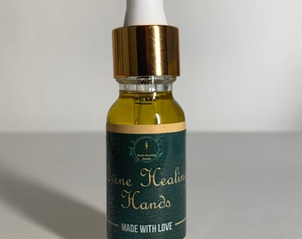 May include: A small, clear glass bottle with a gold lid and a white dropper. The bottle contains a yellow liquid and has a green label that reads "Divine Healing Hands" and "Made with Love".