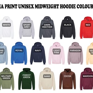 a bunch of different colored hoodies with the words