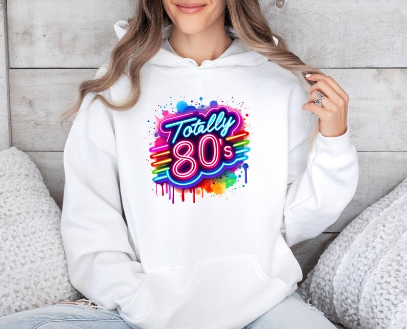 May include: White hoodie with a colorful graphic design that says "Totally 80's" in neon letters with a rainbow drip effect.