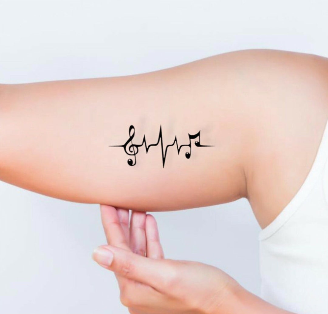 22 Photos of Inspiring Heartbeat Tattoos