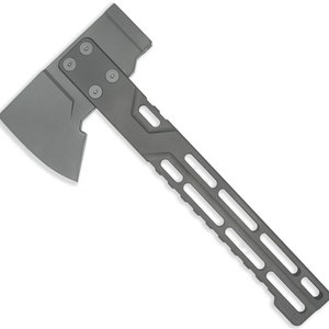 May include: A gray metal axe with a textured handle. The axe has a sharp blade and a hammer head on the back.
