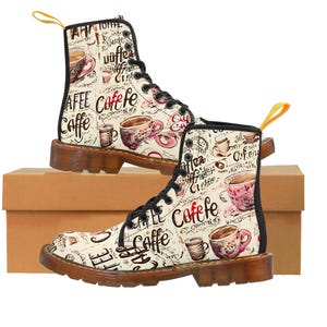May include: White leather boots with black laces and a coffee cup print. The boots have a brown sole and are decorated with the words "Caffe" and "Coffee" in different languages.