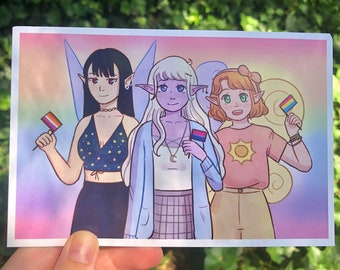 May include: Three cartoon fairies with wings, each holding a different pride flag. The fairy on the left is holding a bisexual pride flag, the middle fairy is holding a bisexual pride flag, and the fairy on the right is holding a pansexual pride flag. The fairies are all smiling and have different coloured hair and skin.