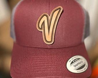 Venezuelan Baseball Logo on Brown Leather on a Trucker Hat. One Size Adjustable. Serie del Caribe