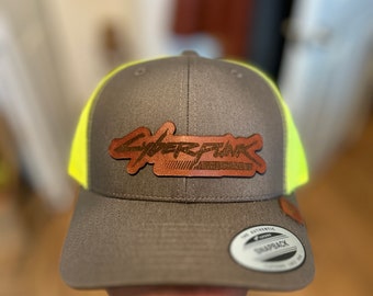 Cyberpunk Edgerunners on Brown Leather on a Trucker Hat. One Size Adjustable.