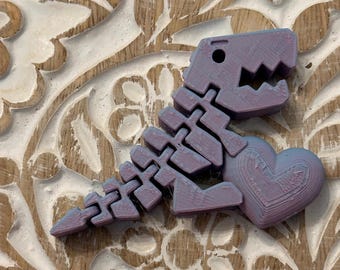 Dinosaurio articulado con corazón: decoración flexible impresa en 3D y juguete antiestrés