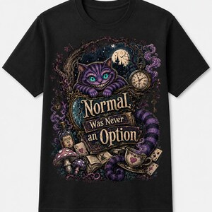 May include: A black short-sleeve t-shirt featuring a graphic print of a purple striped cat, a pocket watch, a teacup, mushrooms, and playing cards. The text "Normal Was Never an Option" is printed in the center in a decorative gold font.