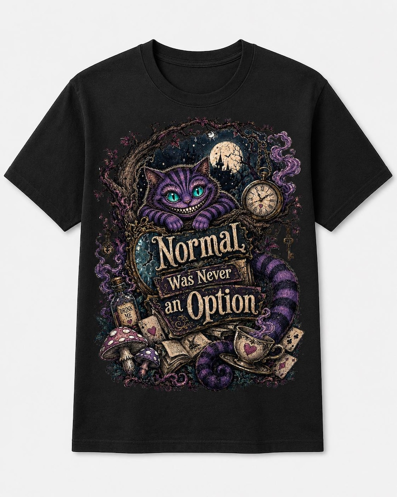 May include: A black short-sleeve t-shirt featuring a graphic print of a purple striped cat, a pocket watch, a teacup, mushrooms, and playing cards. The text "Normal Was Never an Option" is printed in the center in a decorative gold font.