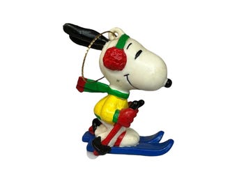 Ornamento vintage Peanuts Snoopy sciatore Babbo Natale cane United Feature Syndicate