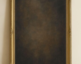May include: A gold-colored ornate picture frame with a dark brown background. The frame has a decorative design with intricate details.