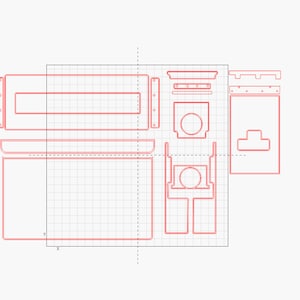 May include: A red line drawing of a woodworking project plan on a grid background. The plan includes multiple pieces of wood with cutouts and holes. The plan is labeled with "X" and "Y" coordinates.