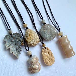 Carved stone best sale pendant