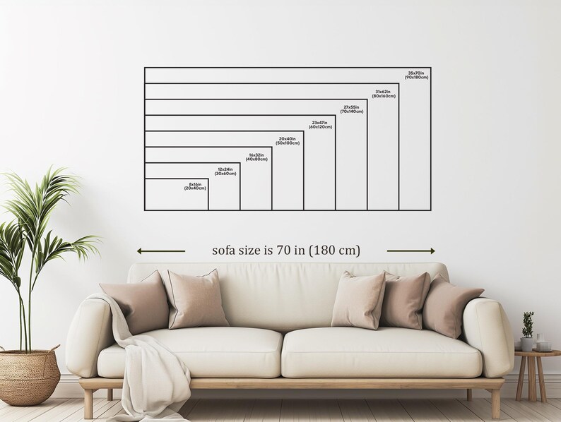 a living room with a large sofa, a potted plant, and a wooden side table. The sofa is described as being 70 inches (180 centimeters) long.