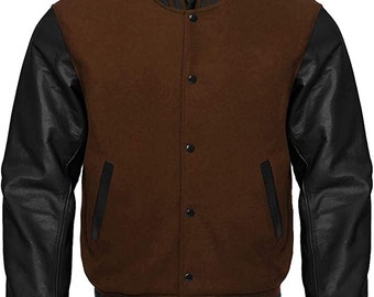 May include: A brown wool varsity jacket with black leather sleeves and black and white striped trim. The jacket has a button closure and two pockets.