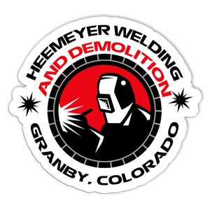 May include: White sticker with a red, black and grey logo. The logo features a welder wearing a welding mask and holding a welding torch. The text around the logo reads "Heemeyer Welding and Demolition Granby, Colorado".