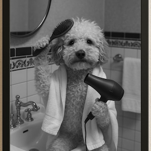 May include: Black and white framed image of a dog in a bathroom. The dog is wearing a white towel and holding a hair dryer and a brush. The dog is standing in front of a sink.