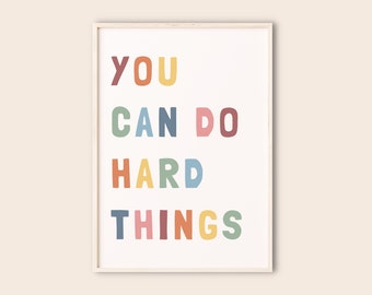 May include: A motivational poster with the text "YOU CAN DO HARD THINGS" in colorful, block letters.