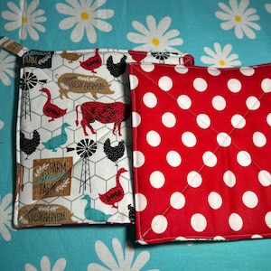 May include: A trio of ceramic mugs with a speckled, matte finish in cream, light grey, and dark grey. Each mug features a simple, minimalist design, ideal for tea or coffee.