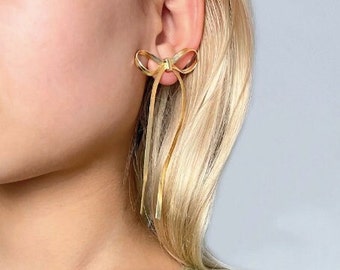 Gold and Silver Elegant Bow Dangle Ribbon Drop Earrings. Presented in a Beautiful Organza Pouch.