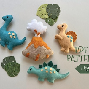 May include: A collection of felt dinosaur and volcano figures in shades of teal, tan, orange, and green. The figures include a Brontosaurus, a Stegosaurus, a volcano, and tropical leaves. The text "PDF PATTERN" and "Step-by-step instruction" are also visible.