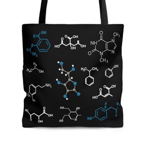May include: Black tote bag with a white background and multiple chemical formulas printed in white and blue. The formulas are for various organic compounds.