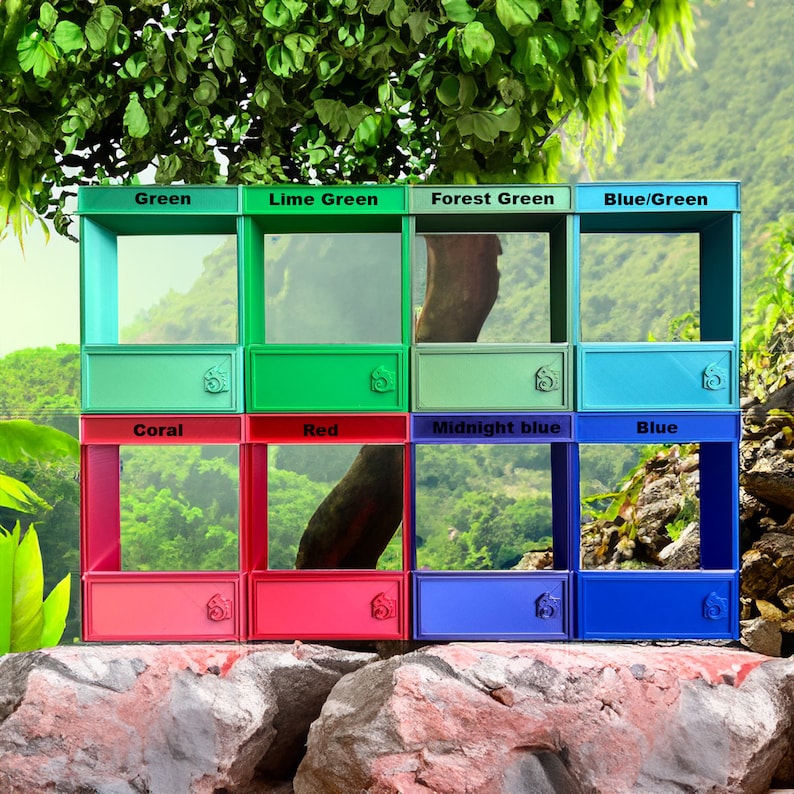 May include: A set of nine colorful wooden boxes with glass fronts. The boxes are arranged in a three by three grid. The top row of boxes is labeled "Green", "Lime Green", "Forest Green", and "Blue/Green". The middle row is labeled "Coral", "Red", "Midnight blue", and "Blue".