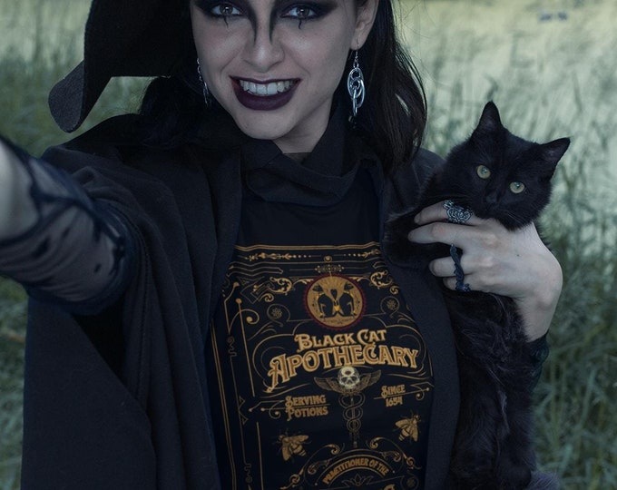 Featured listing image: Vintage Black Cat  Apothecary T-Shirt Retro Black Cat Design Witchy Healing Arts Tee Sizes Small to 3 XL Great For Halloween Parties!
