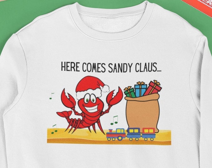 Featured listing image: Here Comes Sandy Claus, Funny Christmas, Lobster Santa shirt From sizes S to 5XL, Tropical Lobster Santa with toy bag Perfect gift!