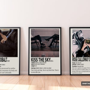 May include: Three black framed posters with white text on a light wood floor. The posters are for a fictional book series called "Kiss the Sky". The first poster features a man in a suit and the text "Connor Cobalt 1989". The second poster features a couple sitting on chairs and the text "Kiss the Sky 2014". The third poster features a woman in a dress and the text "Rose Calloway Cobalt 1989".