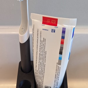 Quip toothbrush holder