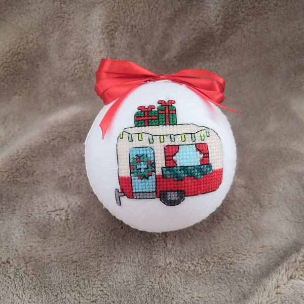 Christmas ball with a decorated trailer and gifts