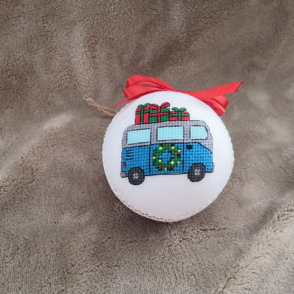 Christmas tree ornament with a bus carrying gifts