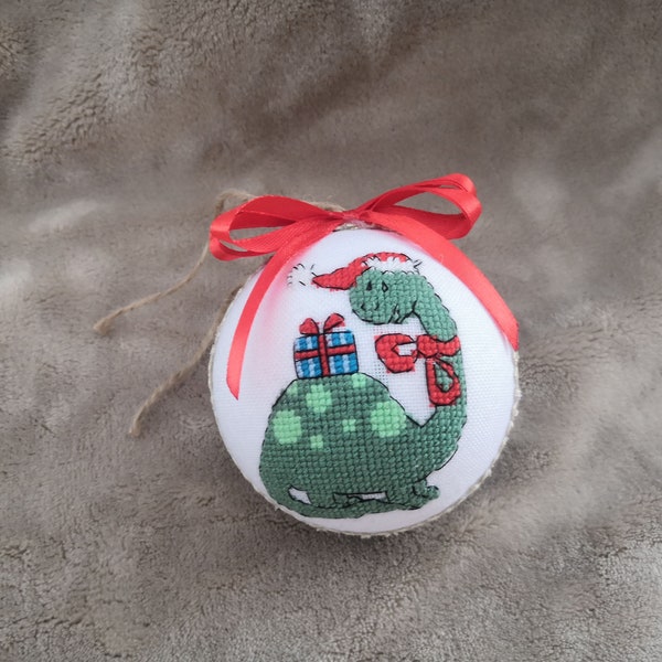 Christmas ornament with a dragon and a gift