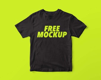 May include: A black t-shirt with the text "FREE MOCKUP" in bright green.