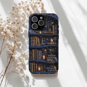 May include: A phone case featuring a detailed illustration of a bookshelf filled with books, candles, and floral accents. The design is in shades of blue and gold, with a starry night sky background.