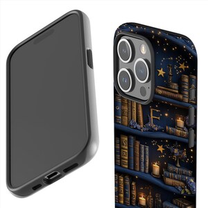 May include: A black smartphone case featuring a detailed illustration of a bookshelf filled with antique books, candles, and stars against a dark blue background. The case has a sleek, modern design with a black border.