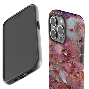 May include: A black phone case with a floral design. The case features a detailed pattern of pink and gold flowers with jewel accents. The phone case is shown from two angles, one side view and one back view.