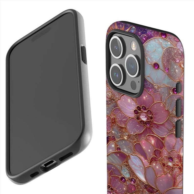 May include: A black phone case with a floral design. The case features a detailed pattern of pink and gold flowers with jewel accents. The phone case is shown from two angles, one side view and one back view.