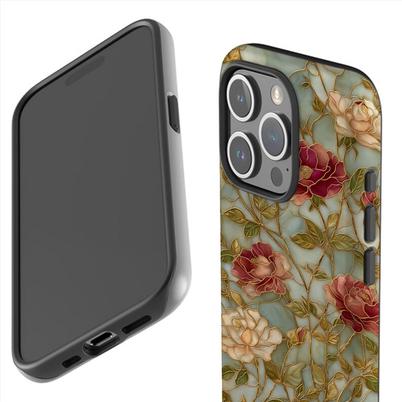 May include: A black smartphone case with a floral design. The case features a pattern of red, cream, and gold flowers on a teal background. The phone's camera lenses are visible.