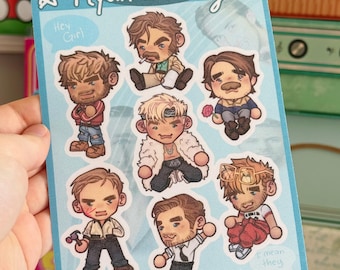 May include: A light blue sticker sheet featuring seven chibi-style illustrations of Ryan Gosling in various movie roles. The text "Ryan Gosling" is at the top, with speech bubbles saying "Hey Girl" and "I mean they" and the handle "@MISCIAE".