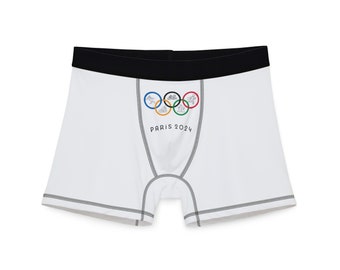 Vorder- und Rückseite der Olympischen Spiele 2024 in Paris mit olympischen Ringen und sportlichen Herren-Boxershorts (AOP)